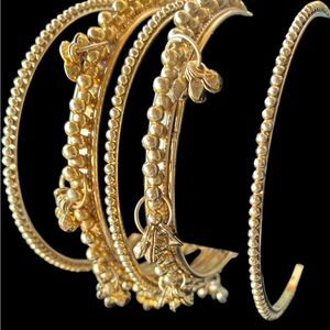 Intricate Gold Bracelets with Textured Patterns